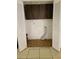 Functional laundry room with built-in cabinets and vinyl flooring at 2222 Silver Pines Pl # 902, Orlando, FL 32808