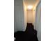 Simple hallway with carpeted flooring and doors to other rooms at 2222 Silver Pines Pl # 902, Orlando, FL 32808
