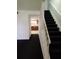 Staircase leading to upper level and kitchen view at 2222 Silver Pines Pl # 902, Orlando, FL 32808