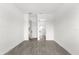 Bright bedroom with wood-look tile floors and an ensuite bathroom at 13839 Larkton Ln, Orlando, FL 32832