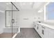 Elegant bathroom featuring a frameless glass shower, double vanity, and gray tile floor at 13839 Larkton Ln, Orlando, FL 32832