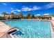 Inviting community pool with plenty of lounge chairs at 13839 Larkton Ln, Orlando, FL 32832