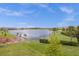 Serene lakefront view of a community with upscale homes at 13839 Larkton Ln, Orlando, FL 32832