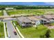Aerial view of a two-story house with a backyard pool at 13839 Larkton Ln, Orlando, FL 32832