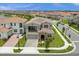 Stunning aerial view of a two-story house in a residential neighborhood at 13839 Larkton Ln, Orlando, FL 32832