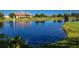Tranquil lake view with clubhouse and fountain at 13839 Larkton Ln, Orlando, FL 32832