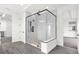 Spa-like bathroom with a large glass shower and gray tile floor at 13839 Larkton Ln, Orlando, FL 32832