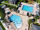 Community pool area with multiple pools and a water playground at 13839 Larkton Ln, Orlando, FL 32832