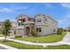 Two-story house with gray exterior and stone accents at 13839 Larkton Ln, Orlando, FL 32832