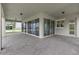 Covered patio with pavers and sliding glass doors at 13839 Larkton Ln, Orlando, FL 32832