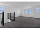 Spacious loft area with large windows and grey carpeting at 13839 Larkton Ln, Orlando, FL 32832