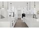 Modern kitchen with white cabinets, large island, and stainless steel appliances at 13839 Larkton Ln, Orlando, FL 32832