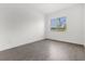 Simple bedroom with wood-look tile floor and a large window at 13839 Larkton Ln, Orlando, FL 32832