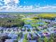 Aerial view of a beautiful community with houses, lakes, and lush greenery at 1669 Anna Catherine Dr, Orlando, FL 32828