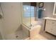 Updated bathroom with a walk-in shower and a soaking tub at 1669 Anna Catherine Dr, Orlando, FL 32828