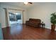 Living room with hardwood floors and sliding glass doors leading to patio at 1669 Anna Catherine Dr, Orlando, FL 32828