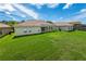 Spacious backyard with lush grass and neighboring homes at 4028 Navigator Way, Kissimmee, FL 34746