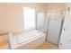 Bathroom with a bathtub and shower at 4028 Navigator Way, Kissimmee, FL 34746