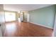 Spacious living room featuring hardwood floors and natural light at 4028 Navigator Way, Kissimmee, FL 34746