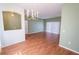Dining room features wood floors and a chandelier at 4028 Navigator Way, Kissimmee, FL 34746