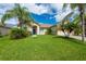 One-story home with a two-car garage and lush landscaping at 4028 Navigator Way, Kissimmee, FL 34746