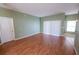 Bright living room with wood floors and sliding glass doors at 4028 Navigator Way, Kissimmee, FL 34746