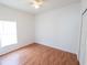 Spacious bedroom with wood floors and large window at 4028 Navigator Way, Kissimmee, FL 34746