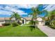 One-story home with a two-car garage and lush landscaping at 4028 Navigator Way, Kissimmee, FL 34746