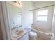 Clean bathroom with a bathtub, toilet, and vanity with sink at 4028 Navigator Way, Kissimmee, FL 34746