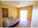 Bedroom with wood floors, ceiling fan and sliding glass doors at 4028 Navigator Way, Kissimmee, FL 34746