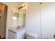 Bathroom with a toilet, sink, and double vanity mirror at 4028 Navigator Way, Kissimmee, FL 34746