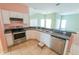 Modern kitchen with stainless steel appliances and ample cabinetry at 4028 Navigator Way, Kissimmee, FL 34746