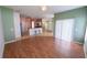 Open kitchen with stainless steel appliances and breakfast bar at 4028 Navigator Way, Kissimmee, FL 34746