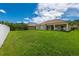 Large backyard with grassy area and a view of neighboring homes at 4028 Navigator Way, Kissimmee, FL 34746