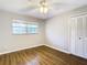 Bright bedroom featuring wood-look floors, a ceiling fan, and a closet at 1046 Forest Cir, Winter Springs, FL 32708