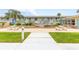 Community pool area with seating and landscaping at 335 N Causeway # B010, New Smyrna Beach, FL 32169