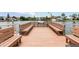 Shared boat dock with benches overlooking the water at 335 N Causeway # B010, New Smyrna Beach, FL 32169