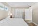 Bedroom with king-size bed, tiled floor, and built-in closet at 335 N Causeway # B010, New Smyrna Beach, FL 32169