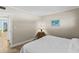 Bright bedroom with a comfortable bed and access to another room at 335 N Causeway # B010, New Smyrna Beach, FL 32169