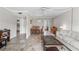Open living area with a dining table and comfortable seating at 335 N Causeway # B010, New Smyrna Beach, FL 32169