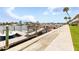Community boat dock with multiple slips and seating at 335 N Causeway # B010, New Smyrna Beach, FL 32169