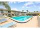Inviting community pool with lounge chairs at 335 N Causeway # B010, New Smyrna Beach, FL 32169