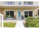 Ground floor condo with patio furniture and slider doors at 335 N Causeway # B010, New Smyrna Beach, FL 32169