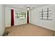 Simple bedroom with carpet flooring, window, and wall shelving at 437 Oak Haven Dr # 437, Altamonte Springs, FL 32701