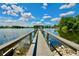 Wooden dock extending into a lake with a gazebo at the end at 437 Oak Haven Dr # 437, Altamonte Springs, FL 32701