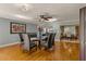 Bright dining room with hardwood floors, glass table, and leather chairs at 9525 Mcnorton Rd, Altamonte Springs, FL 32714