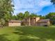 Brick house with large backyard, showcasing the home's curb appeal at 9525 Mcnorton Rd, Altamonte Springs, FL 32714