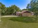 Brick house with attached garage and expansive lawn at 9525 Mcnorton Rd, Altamonte Springs, FL 32714