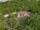 Aerial view showing home surrounded by trees at 9525 Mcnorton Rd, Altamonte Springs, FL 32714
