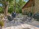 Relaxing patio with fire pit and seating area, perfect for outdoor entertaining at 9525 Mcnorton Rd, Altamonte Springs, FL 32714